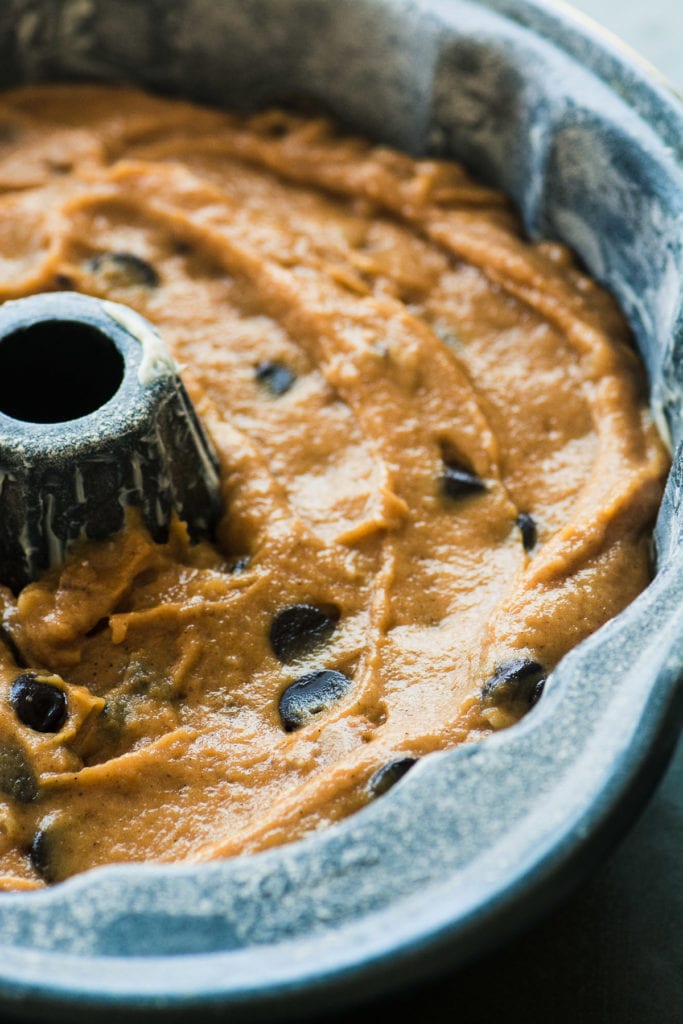 chocolate chip pumpkin bread batter in a bundt pan