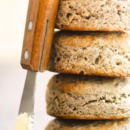 a stack of buckwheat biscuits with a butter knife.