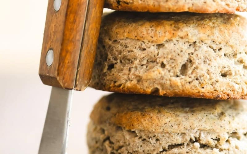a stack of buckwheat biscuits with a butter knife.