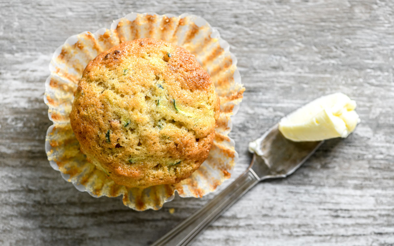 zucchini muffin with butter knife