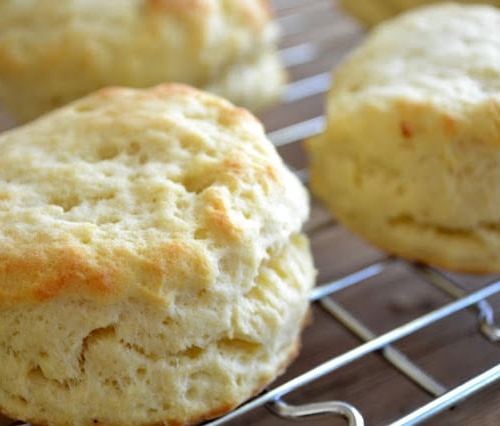 Down Home Sweet Potato Biscuits with Country Gravy ~ these tender biscuits are made impossibly light and fluffy with sweet potato, and they make the perfect base for a classic Southern country gravy!