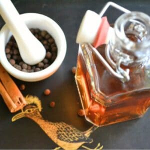 Homemade allspice dram with spices.