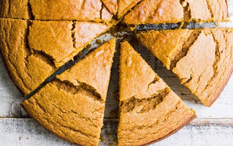 pumpkin cornbread sliced into thick wedges.