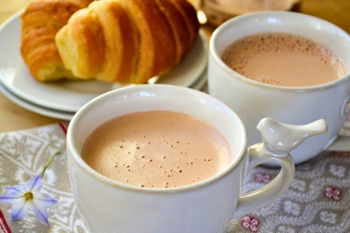 French press breakfast chocolate in white cups.