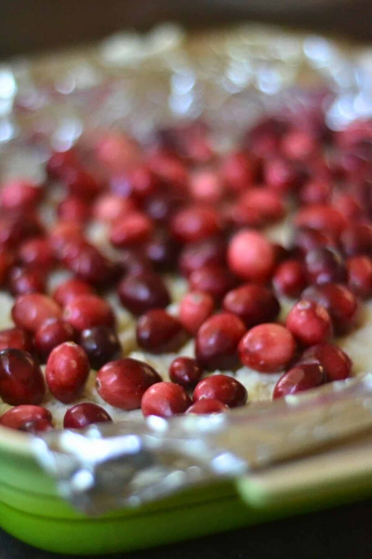 Fresh cranberries on top of shortbread dough crust.