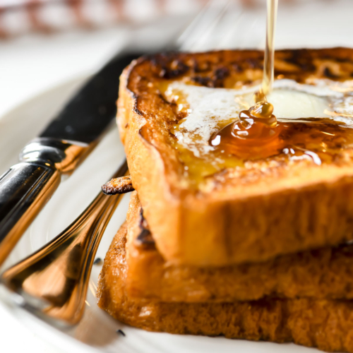 Drizzling maple syrup on gingerbread French Toast.