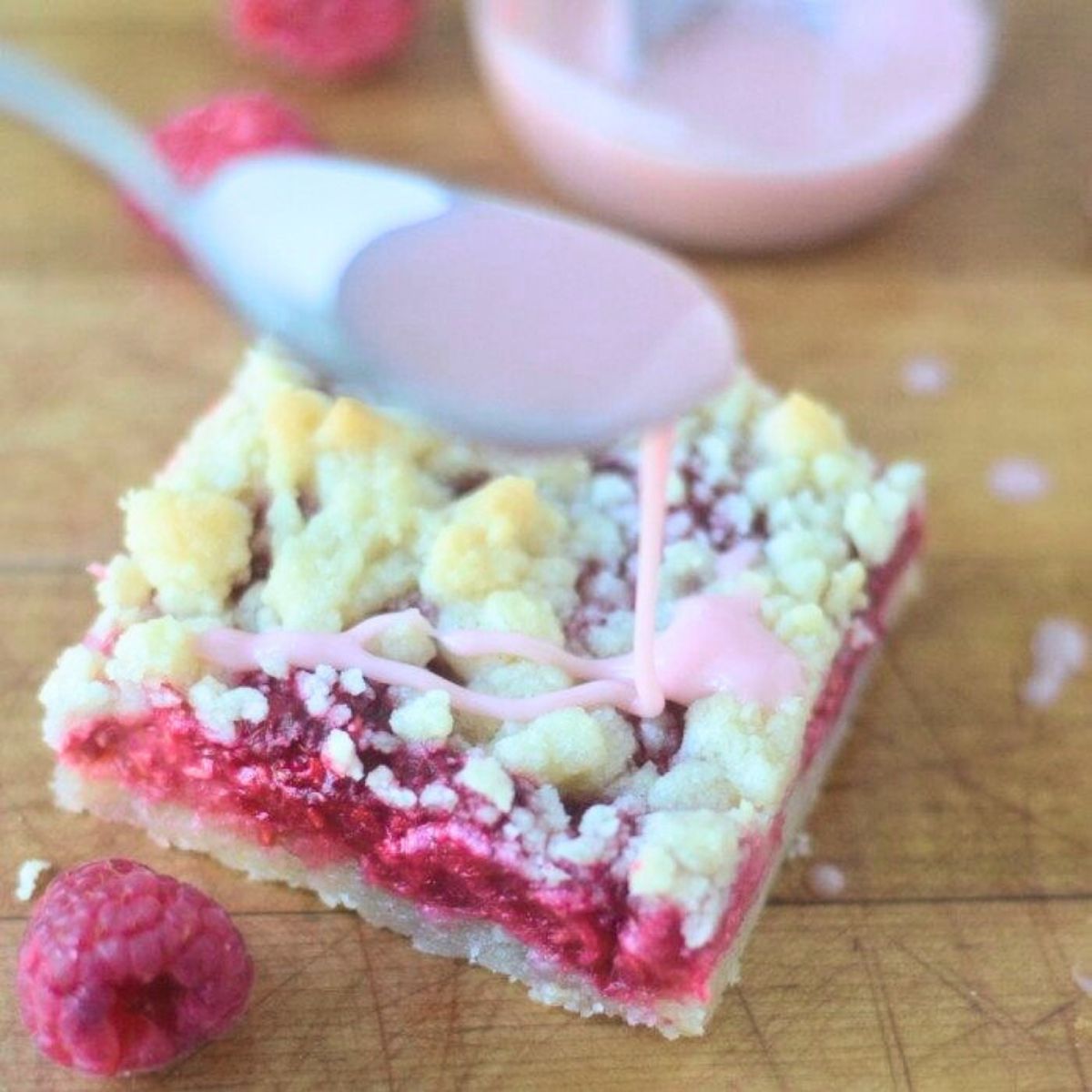 Glazing a raspberry chambord bar.