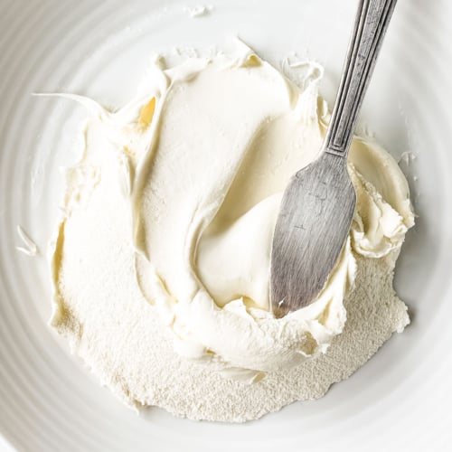 Homemade mascarpone cheese, with spreading knife.