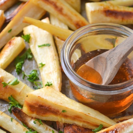 honeyed parsnips on a roasting pan.
