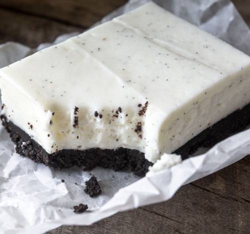 No Bake Vanilla Bean Cheesecake Squares with a deep dark chocolate cookie crust