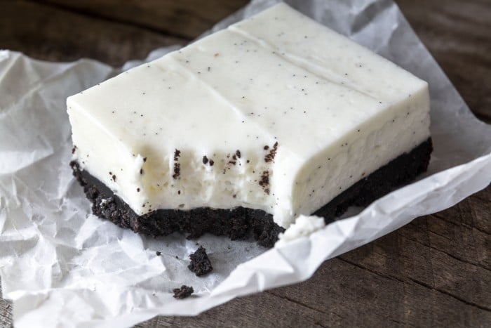 No Bake Vanilla Bean Cheesecake Squares with a deep dark chocolate cookie crust
