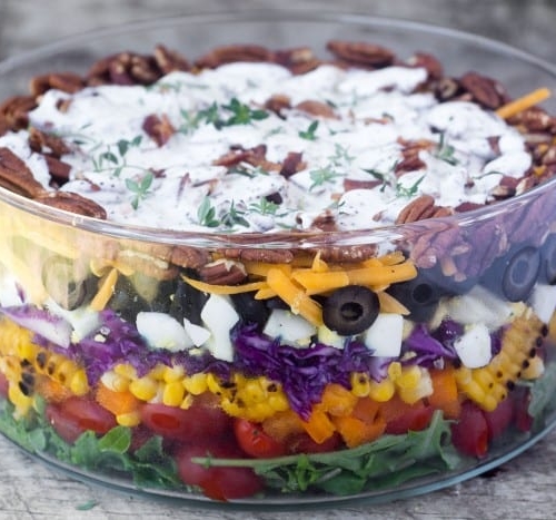 Easy to asemble and healthy Layered Rainbow Salad can be made a head before a picnic, potluck, or barbecue.