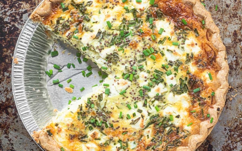 Sweet onion and herb quiche in a pan.
