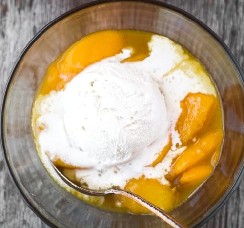 Fresh and juicy Bourbon Fried Peaches with Ice Cream is the most luxurious fruit dessert out there! | theviewfromgreatisland.com