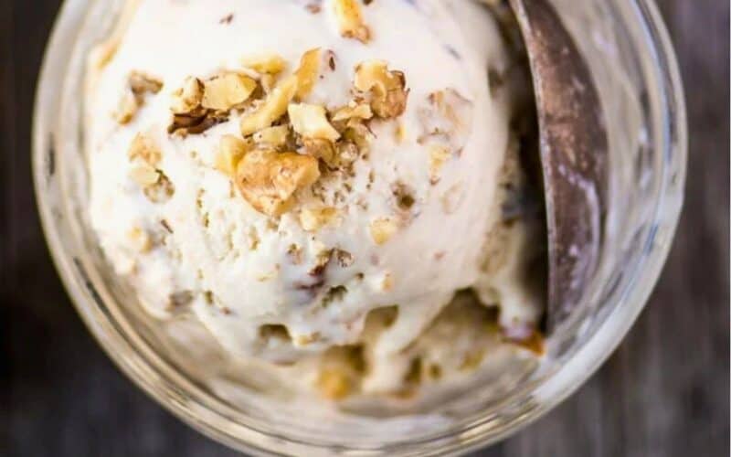 Maple walnut ice cream in a bowl with spoon.