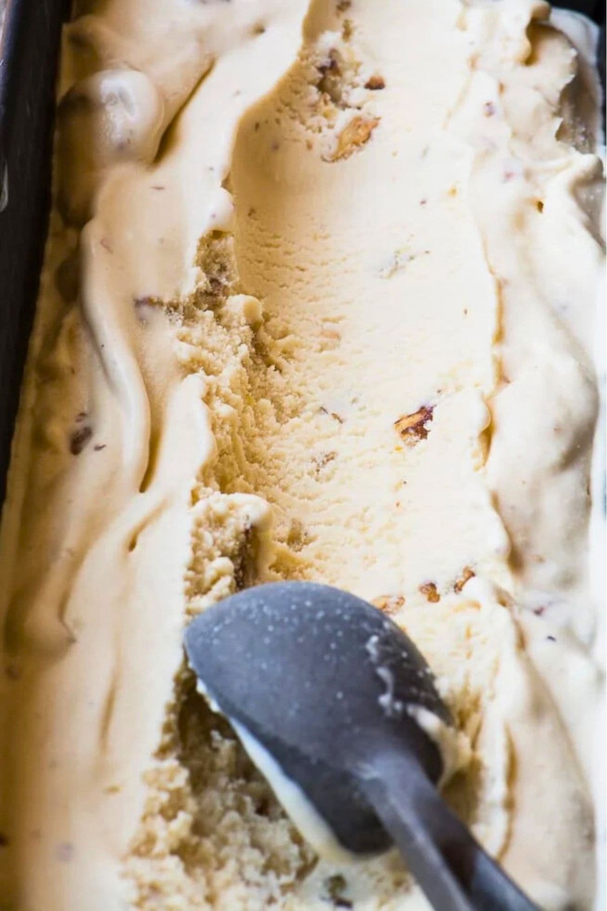 scooping homemade maple walnut ice cream.