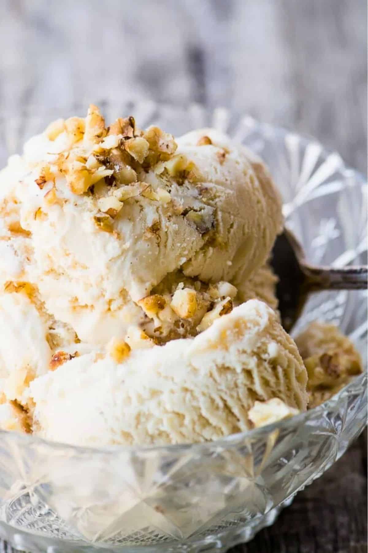 double scoops of maple walnut ice cream in an old fashioned cut glass bowl.