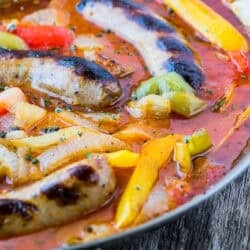 Classic Italian Sausage and peppers in a skillet.