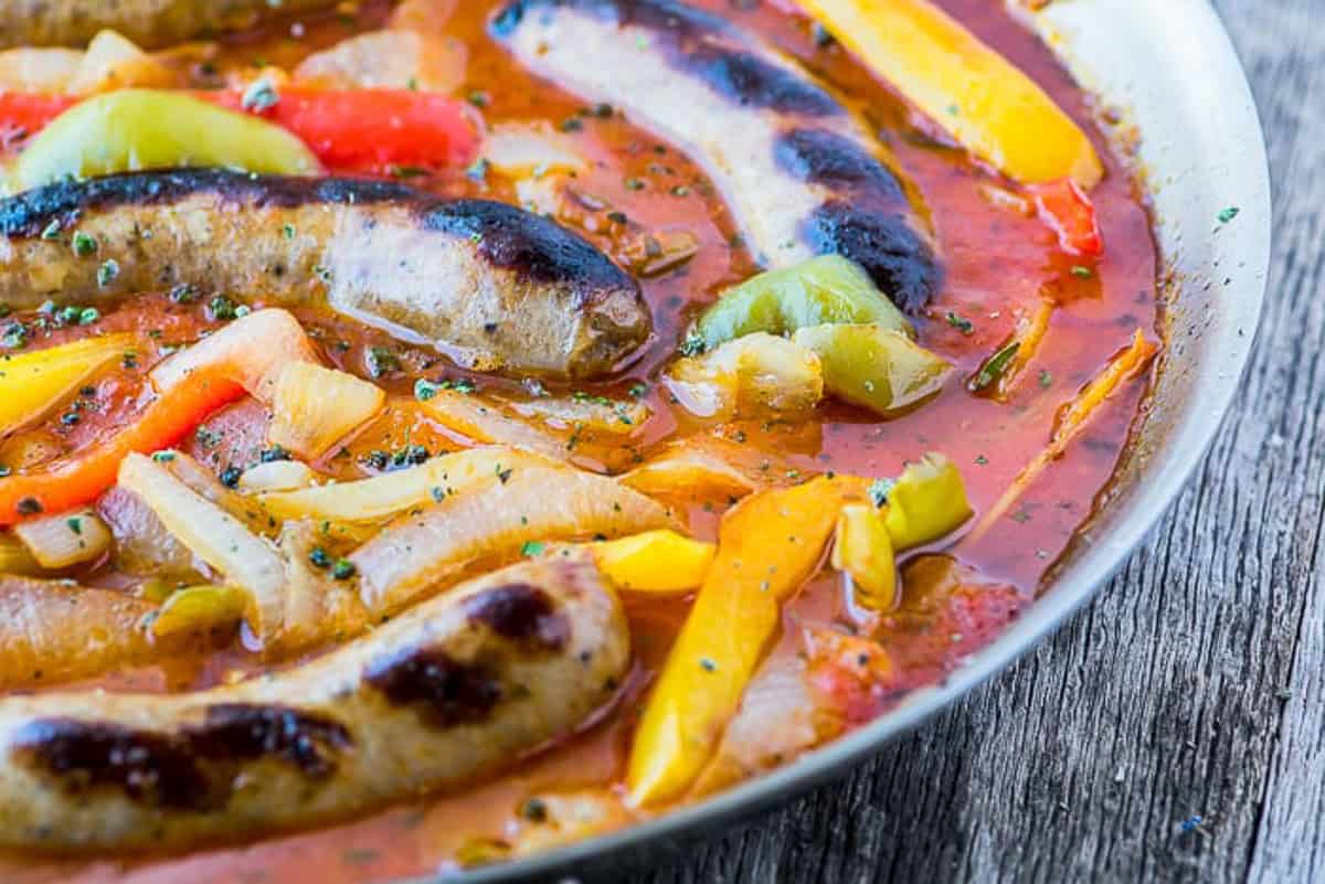Classic Italian Sausage and peppers in a skillet.