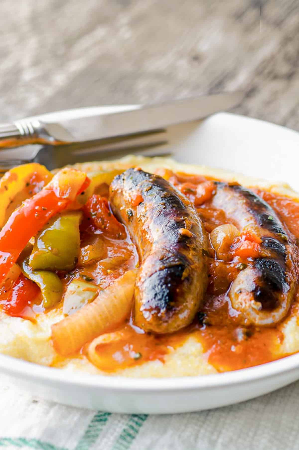 Italian sausage and peppers over polenta.