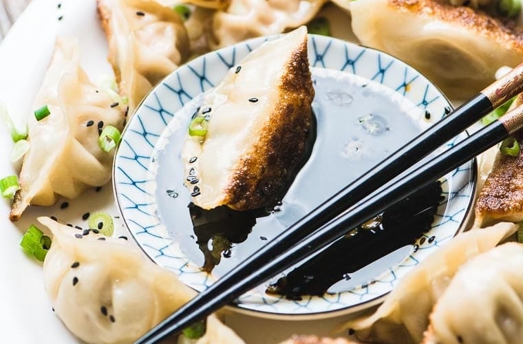 Japanese Pork Dumplings with Ginger and Green Onions ~ these tender potstickers are packed with flavor and make an ideal appetizer or light dinner.