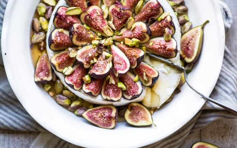 Figs on Brie, with knife.