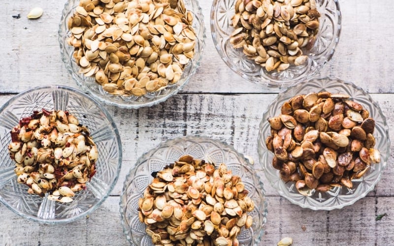 roasted winter squash seeds in small bowls