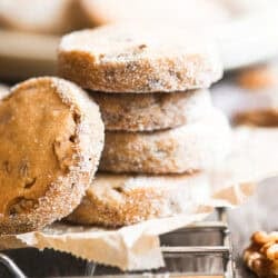 a stack of maple walnut shortbread cookies on a rack.