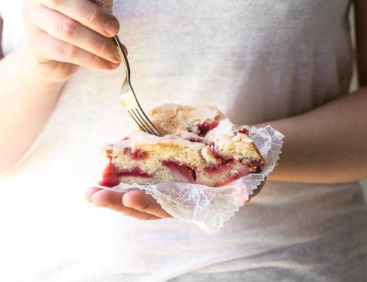 Girl holding a slice of Strawberry Buttermilk Cake