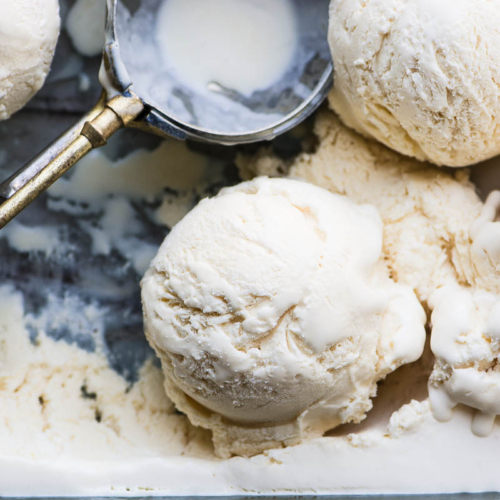 Overhead photo of Ballymaloe no churn vanilla ice cream with old fashioned scoop