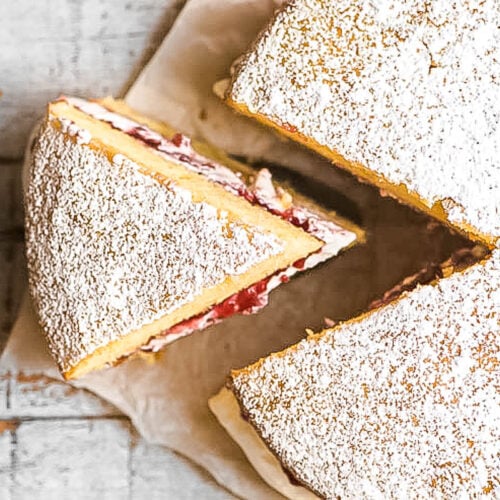 Victoria Sponge Cake on a piece of parchment paper.