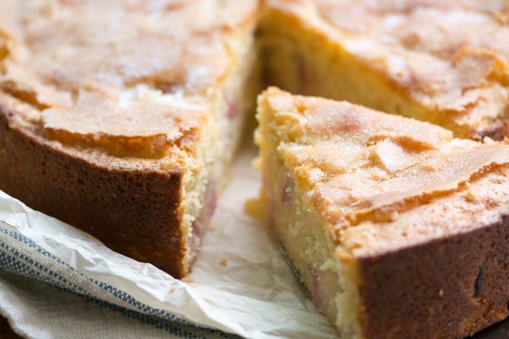 Peaches and Cream Breakfast Cake with a slice taken