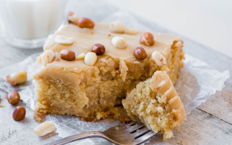 A slice of old fashioned peanut butter cake with fork
