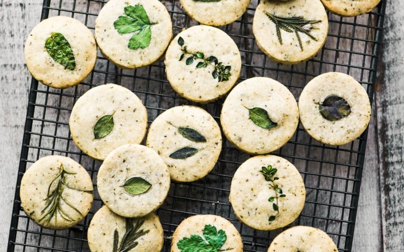 Savory herb shortbread crackers on a cooling rack
