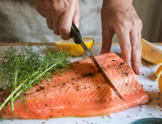 slicing a whole side of salmon
