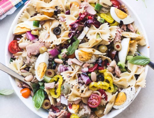 Mediterranean Pasta Salad with Tuna in a white bowl