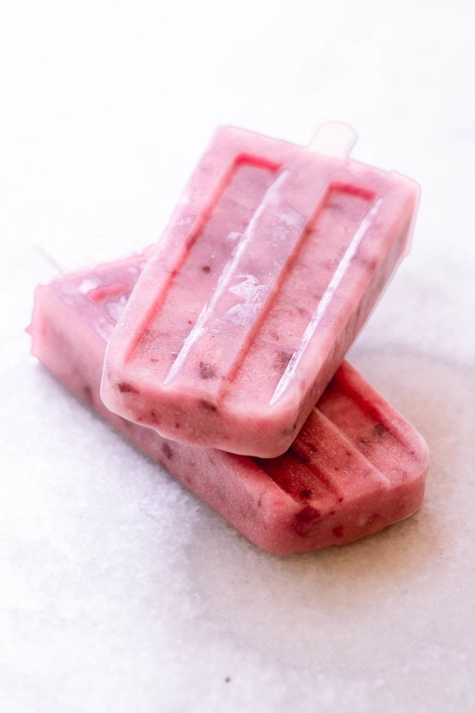 a stack of two white peach popsicles