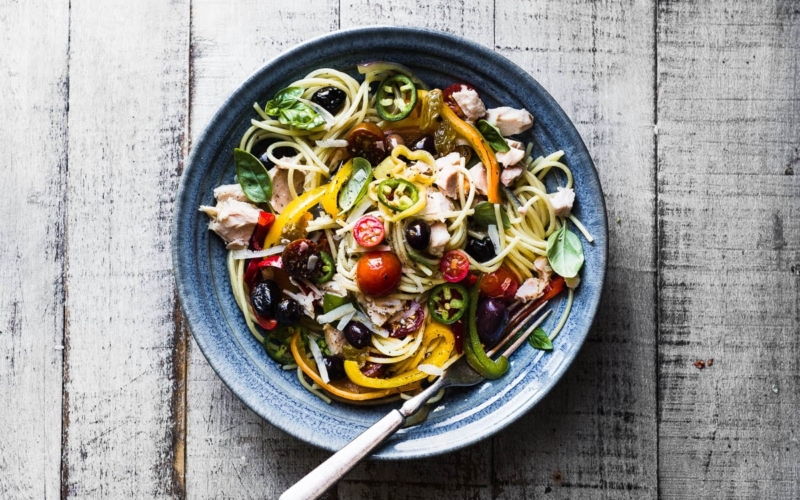 Pasta peperonata with tuna in a bowl with fork