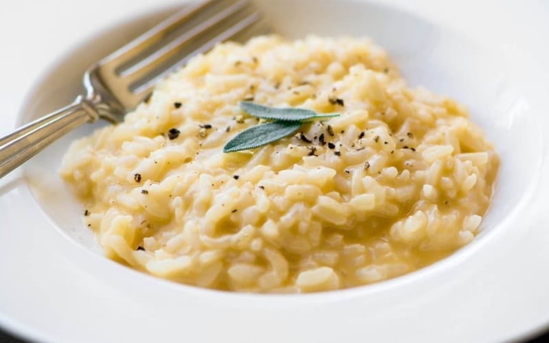 Instant Pot Cheddar Risotto with fresh sage leaves