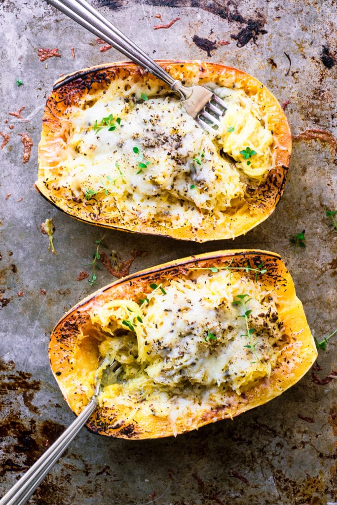cacio e pepe spaghetti squash on a bakingn sheet.
