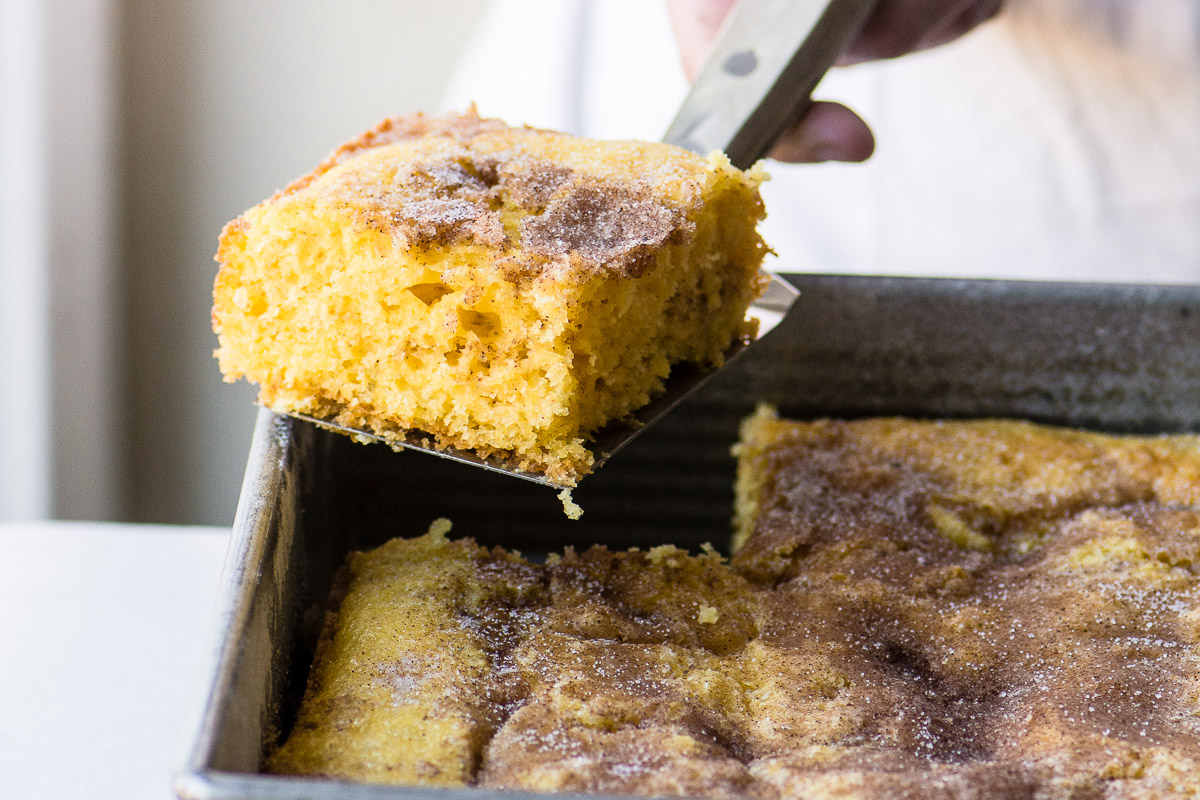 Serving a piece of easy cinnamon coffee cake.