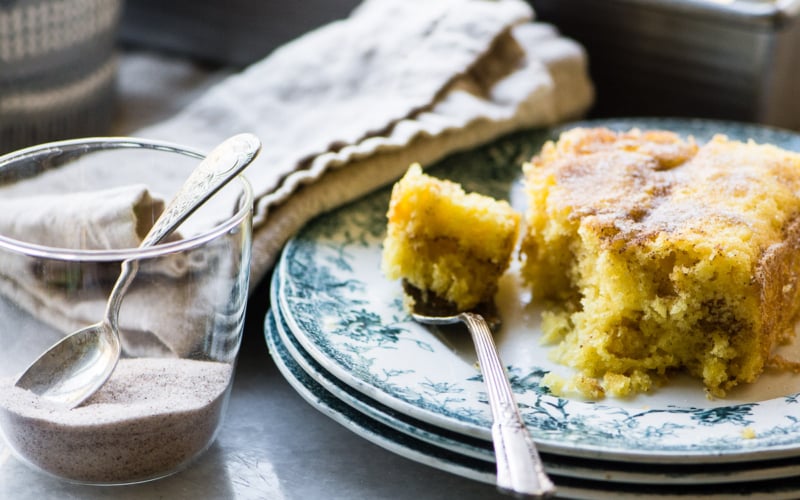 Super easy cinnamon coffee cake on a blue plate with fork