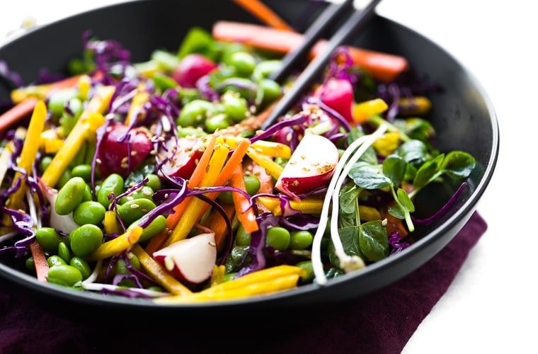 Edamame Salad in a black bowl with chopsticks