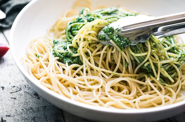 Tossing pasta with a chive parsley pesto