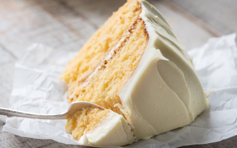 A big slice of Creamsicle Cake, with fork