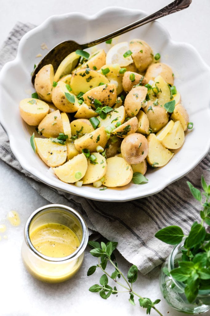 Greek Lemon Potato Salad in a white bowl