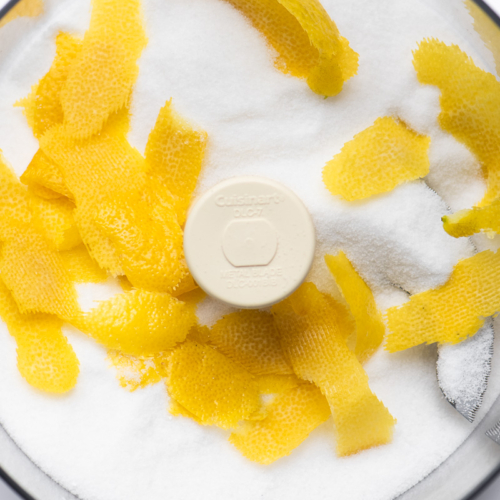 Making citrus sugar in a food processor with sugar and lemon zest