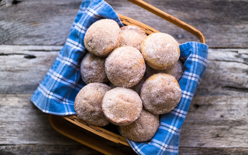 apple cider doughnut muffins in a basket