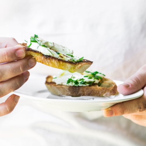 herb marinated goat cheese on slices of toasted bread