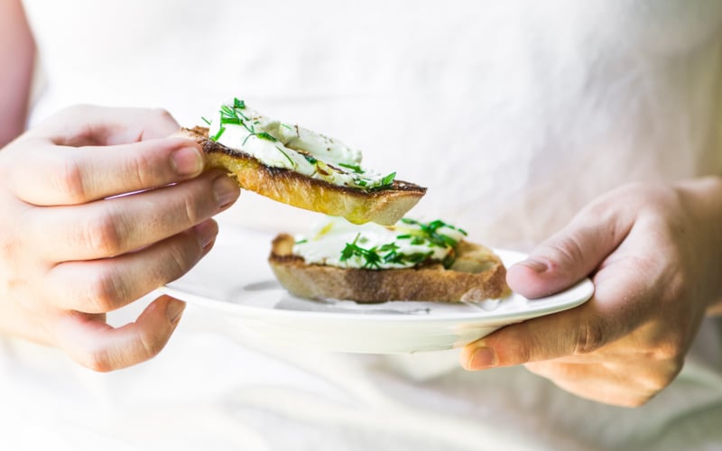 herb marinated goat cheese on slices of toasted bread